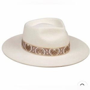 Lack of color hat “The Beverly” in ivory white and gold bronze detail. NWT